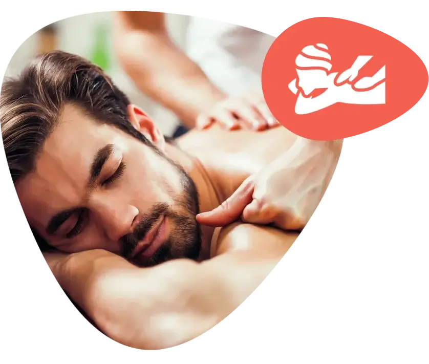 A person receiving a relaxing full-body massage on a spa table.